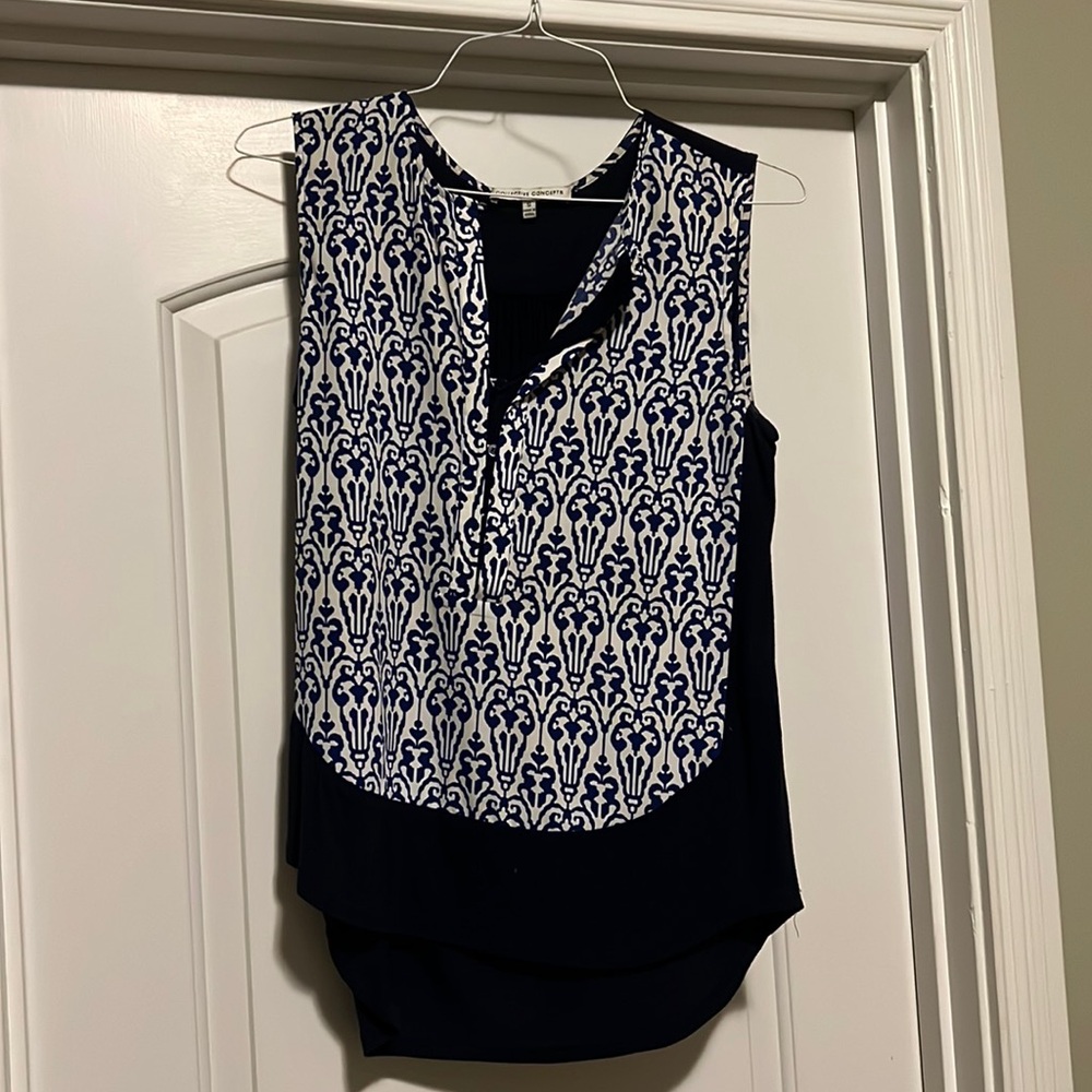 Long dressy tank, solid navy in back. Shorter in front